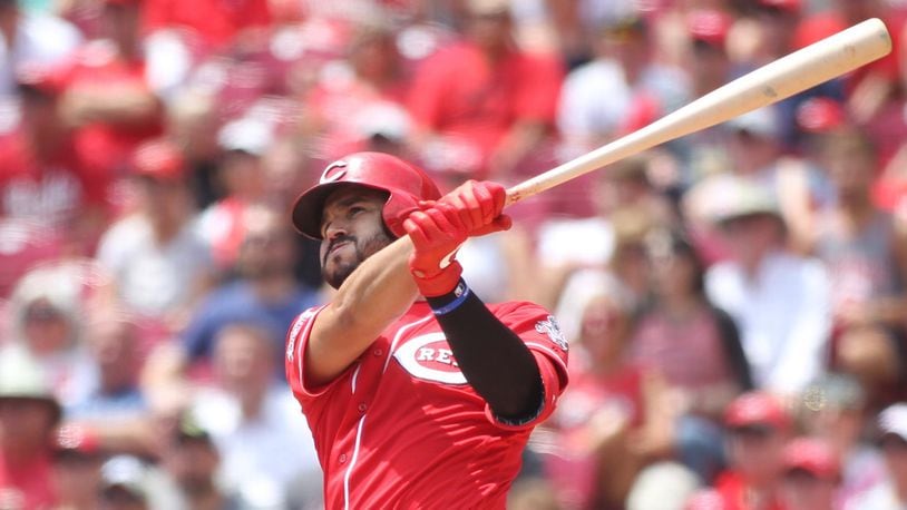 The Reds’ Eugenio Suarez hits a two-run home run in the third inning against the Pirates on Wednesday, July 31, 2019, at Great American Ball Park in Cincinnati. David Jablonski/Staff