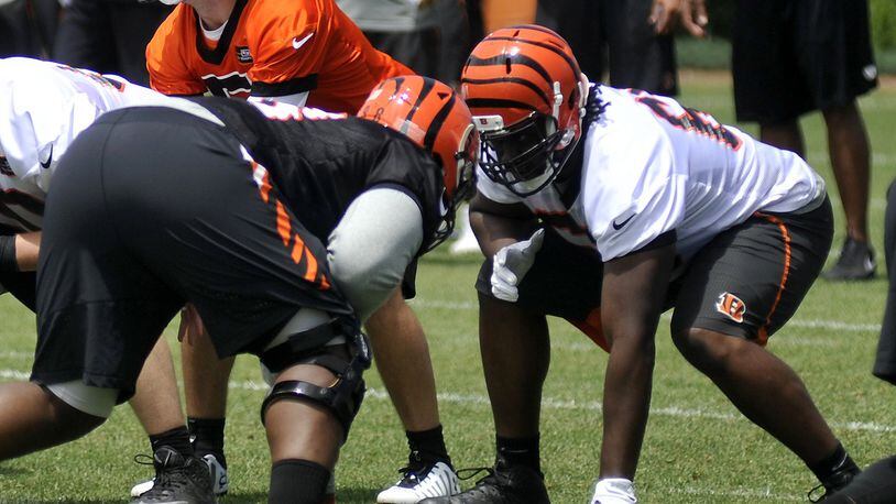 Cincinnati Bengals offensive lineman Trey Hopkins (right) has played all five positions this spring. JAY MORRISON/STAFF