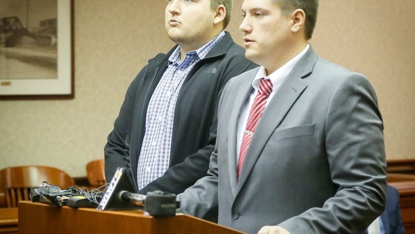 Fairfield High School teacher Tyler Conrad, left, and his defense attorney Matthew Davidson appeared Wednesday in Butler County Common Pleas Court. Conrad pleaded not guilty to charges of having sexual contact with a student. GREG LYNCH/STAFF
