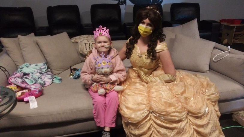 Belle, a character from Beauty and the Beast, visits Naomi Short, 9, of Hamilton, while she and her parents are vacationing in Orlando. Naomi has been diagnosed with a rare form of brain cancer. SUBMITTED PHOTO