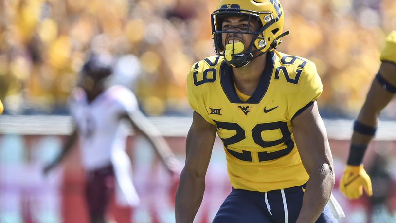 West Virginia safety Sean Mahone (29) reacts after making a play against Virginia Tech during the first half of an NCAA college football game in Morgantown, W.Va., Saturday, Sep. 18, 2021. (AP Photo/William Wotring)