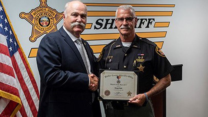Butler County Sheriff Jones congratulates Deputy Doug Hale, who was recently named Deputy of the Year.