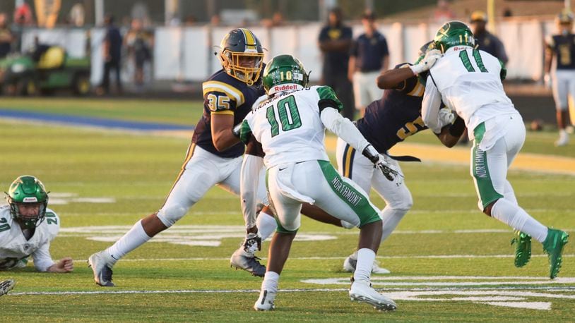 Northmont's Rod Moore (10) tries to tackle Springfield's Jeff Tolliver on Sept. 20, 2019, at Springfield High School. Photo by Michael Cooper