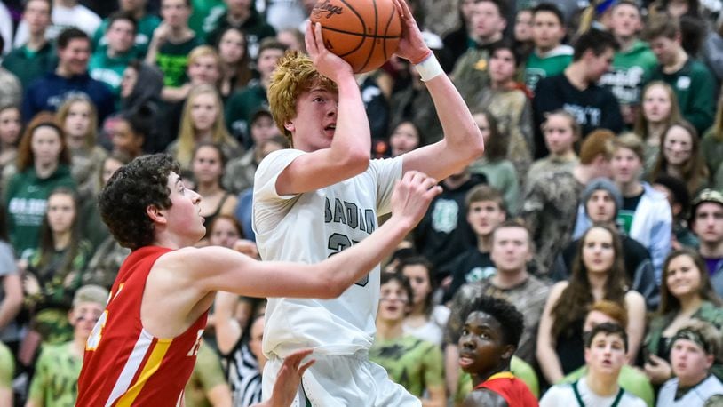 Badin’s Zach Switzer puts up a shot defended by Fenwick’s Nick Braun during their game Jan. 19, 2018, at Mulcahey Gym in Hamilton. Fenwick won 61-56 in overtime. NICK GRAHAM/STAFF