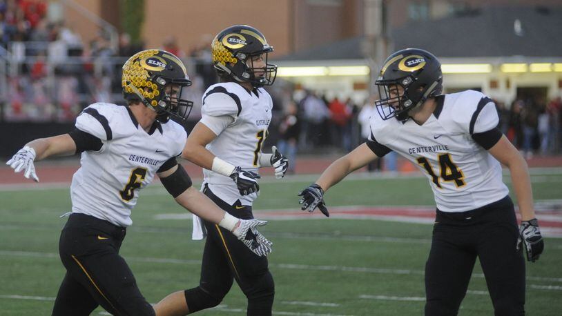 Centerville’s Riley Poulton (left) is greeted by J.R. Melzer after Poulton’s interception. Centerville defeated host Wayne 39-22 in a Week 6 high school football game on Friday, Sept. 29, 2017. MARC PENDLETON / STAFF