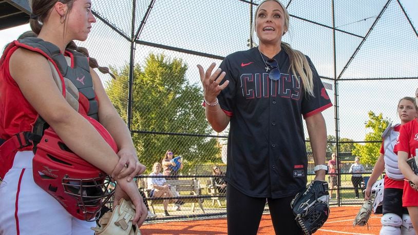 Fairfield senior Karley Clark stands with former Olympian softball pitcher Jennie Finch during a pitchers and catchers camp at the Reds RBI Youth Academy last week.  CONTRIBUTED