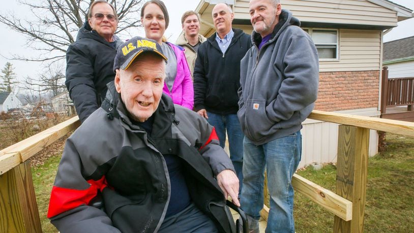 Army veteran Jessie Philpot was able to return home after being released from the hospital thanks to a new wheelchair ramp installed at his home with the help of SELF. With Philpot are his granddaughter and her boyfriend, and from SELF, John Post, Casey Taylor and Greg Sargent. GREG LYNCH / STAFF