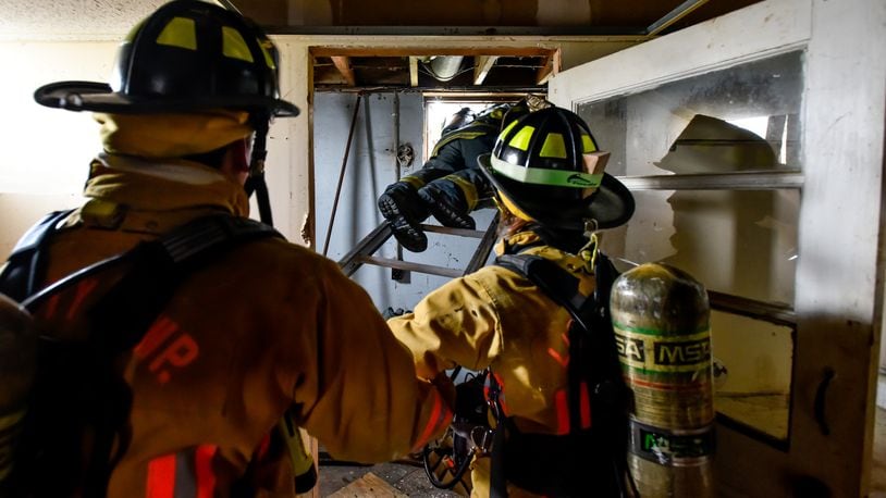 Ohio Gov. John Kasich signed Senate Bill 27, now known as the “Michael Louis Palumbo Jr. Act,” into law Jan. 4. It allows firefighters who have cancer to file claims with the Ohio Bureau of Workers Compensation. Pictured are firefighters from various Butler County jurisdictions during a training exercise last spring. STAFF FILE/2016