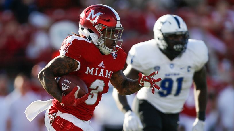 OXFORD, OH - OCTOBER 21: Kenny Young #3 of the Miami Ohio Redhawks runs with the ball chased by Demone Harris #91 of the Buffalo Bulls during the second half at Yager Stadium on October 21, 2017 in Oxford, Ohio. (Photo by Michael Reaves/Getty Images)