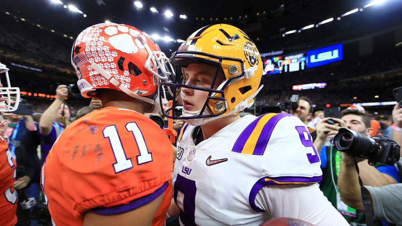 NEW ORLEANS, LOUISIANA - JANUARY 13: Joe Burrow #9 of the LSU Tigers congratulates Isaiah Simmons #11 of the Clemson Tigers after their 42-25 win in the College Football Playoff National Championship game at Mercedes Benz Superdome on January 13, 2020 in New Orleans, Louisiana. (Photo by Mike Ehrmann/Getty Images)