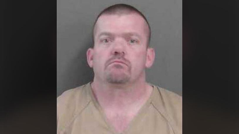 A woman at the home told authorities Edward Wayne Williams, 39, had assaulted her and threatened her with the device. Williams was arrested and charged with aggravated assault and making terroristic threats.