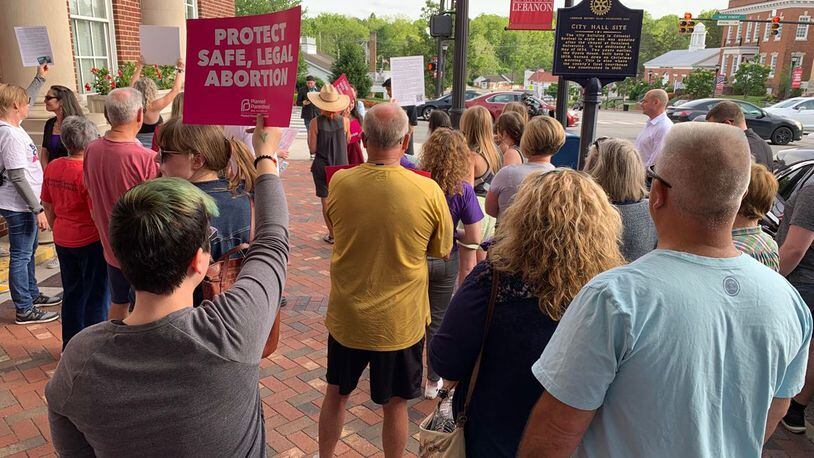 Abortion rights supporters hold a rally in front of the Lebanon City Building in May 2022 before a Lebanon City Council meeting. ED RICHTER/STAFF