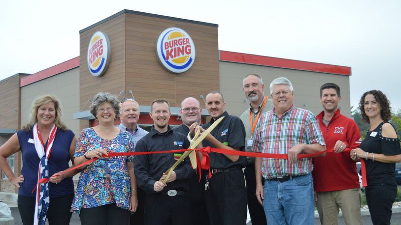 Chamber of Commerce members, city officials and Burger King management took part in a formal ribbon-cutting ceremony at the restaurant Oct. 5, hosted by the Chamber. CONTRIBUTED/BOB RATTERMAN