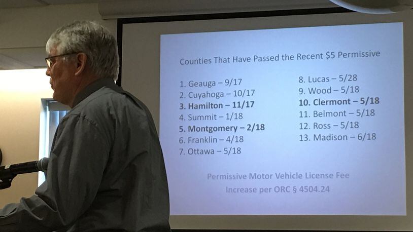 Warren County Engineer Neil Tunison will have another $1.1 million for road and bridge projects since the county commissioners approved a $5 increase in motor vehicle fees. He stands in front of a list of counties that have added the fee. STAFF / LAWRENCE BUDD