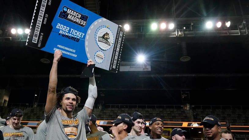 Wright State's Tanner Holden celebrates after Wright State defeated Northern Kentucky 72-71 in an NCAA college basketball game fot the Horizon League men's tournament championship Tuesday, March 8, 2022, in Indianapolis. (AP Photo/Darron Cummings)