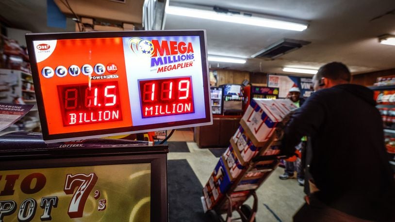 The lottery business was brisk at Vinny's Bar and Grill on Dryden Road in Moraine Friday November 4, 2022. The Powerball lottery has reached a whopping $1.6 billion. JIM NOELKER/STAFF