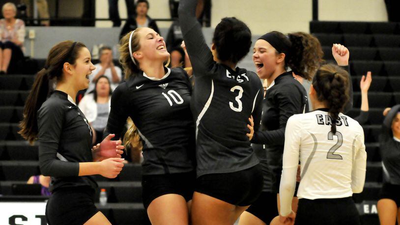 Lakota East players celebrate during a 3-0 victory over visiting Lakota West on Thursday night in Greater Miami Conference volleyball action. CONTRIBUTED PHOTO BY DAVID A. MOODIE
