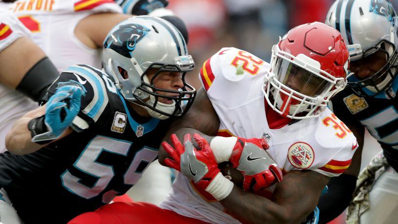 CHARLOTTE, NC - NOVEMBER 13: Luke Kuechly #59 of the Carolina Panthers tackles Spencer Ware #32 of the Kansas City Chiefs in the 1st quarter during their game at Bank of America Stadium on November 13, 2016 in Charlotte, North Carolina. Both Kuechly (St. Xavier) and Ware (Princeton) are from Cincinnati. (Photo by Streeter Lecka/Getty Images)