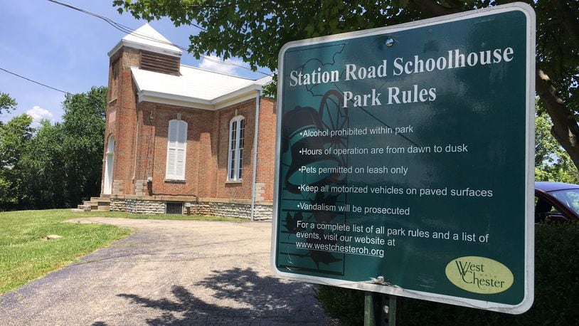 Neighbors of the Station Road schoolhouse have filed a motion to intervene in the lawsuit the owners of the Montessori School filed against West Chester Twp. The township has agreed to sell the property to the school, over objections of neighbors. MICHAEL D. CLARK/STAFF