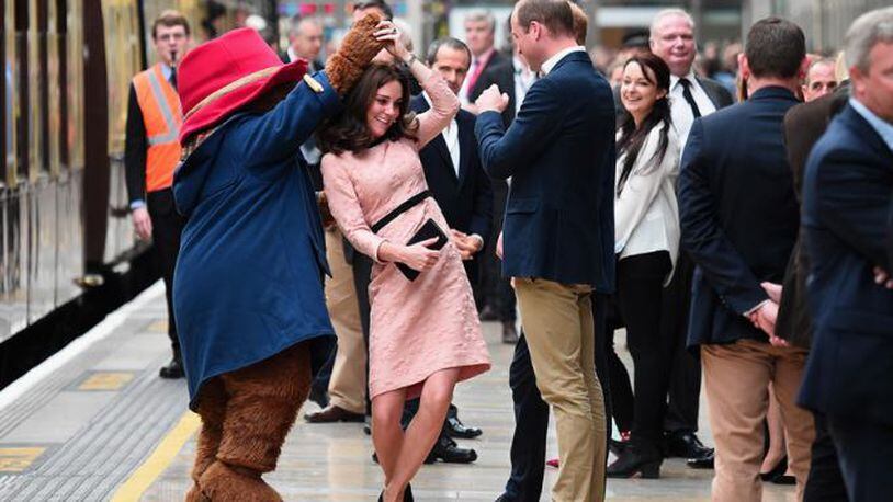 LONDON, ENGLAND - OCTOBER 16:  Paddington Bear dances with Catherine, Duchess of Cambridge and Prince William, Duke of Cambridge at the Charities Forum Event on board the Belmond Britigh Pullman train at Paddington Station on October 16, 2017 in London, England.  (Photo by Eamonn M. McCormack/Getty Images)