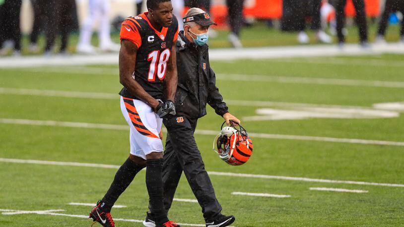 Cincinnati Bengals wide receiver A.J. Green (18) walks off the field after being injured in the second half of an NFL football game against the Jacksonville Jaguars in Cincinnati, Sunday, Oct. 4, 2020. (AP Photo/Aaron Doster)