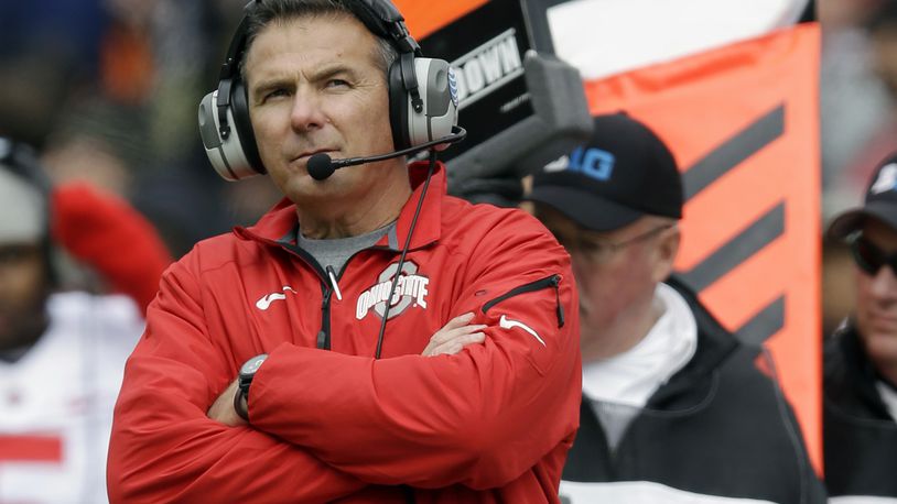 FILE - In this Nov. 2, 2013, file photo, Ohio State head coach Urban Meyer watches from the sideline during the second half of an NCAA college football game against Purdue in West Lafayette, Ind. Ohio State tied a previous school record with a quintet of players selected in the first round Thursday night, April 28, 2016, in Chicago. (AP Photo/Michael Conroy, File)