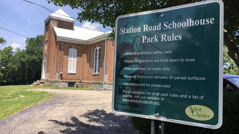 The historic Station Road schoolhouse in West Chester Twp. continues to be at the center of a battle between the owners of the Community Montessori School and neighbors who don’t want them to be able to buy the building from the township. FILE