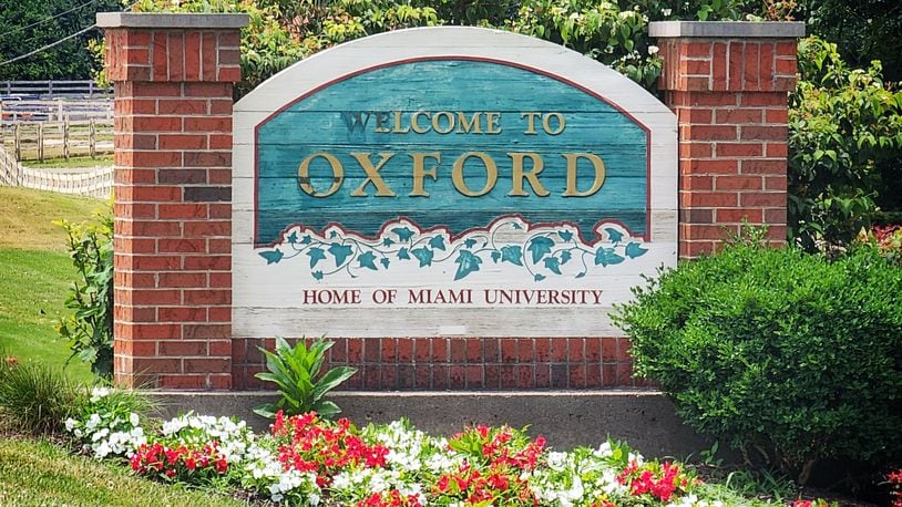 A sign welcomes visitors as they enter Oxford. NICK GRAHAM/STAFF