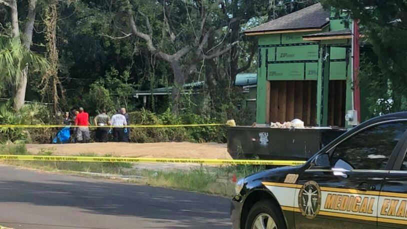 A woman's body was found Saturday inside a burned port-a-potty in front of a home under construction in Florida, investigators said.
