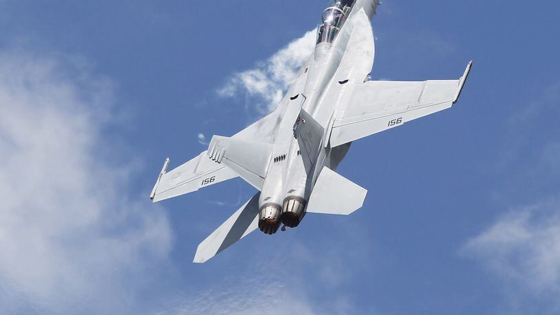 An F/A-18 Super Hornet performs at the Vectren Dayton Air Show in June. GE Aviation operations in Vandalia produce alternative generators for the fighter jet. TY GREENLEES/STAFF