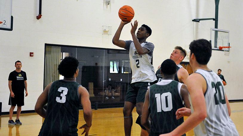 Wright State freshman Malachi Smith puts up a shot during Tuesday’s team workout at Setzer Pavilion. JAY MORRISON/STAFF