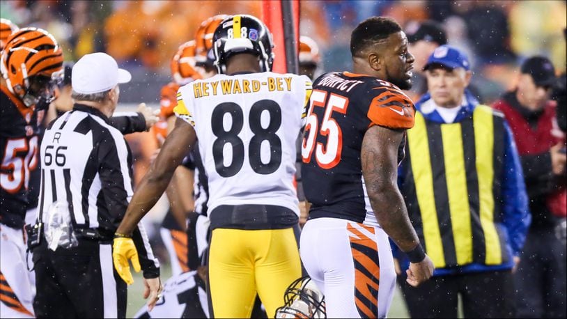 Bengals linebacker Vontaze Burfict (55) talks to other players during their game against the Steelers at Paul Brown Stadium, Monday, Dec. 4, 2017. GREG LYNCH / STAFF