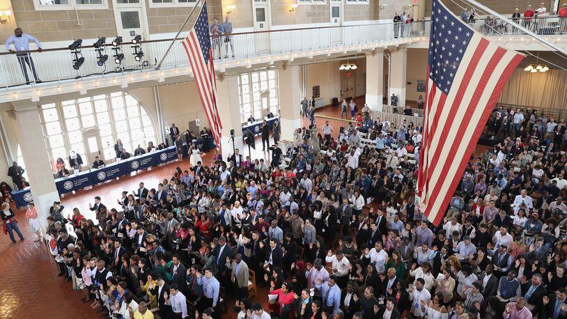 NEW YORK, NY - SEPTEMBER 16: Immigrants take the oath of citizenship to the United States in the Great Hall of Ellis Island on September 16, 2016 in New York City. Several Republican House members introduced legislation that would require all federal government business to be conducted in English in February 2017. (Photo by John Moore/Getty Images)