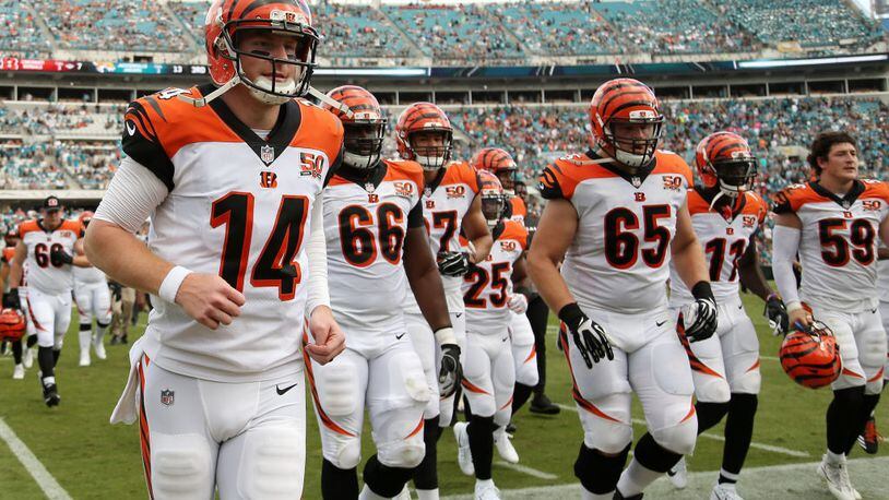 JACKSONVILLE, FL - NOVEMBER 05:  Andy Dalton #14 of the Cincinnati Bengals leaves the field with his teammates at halftime of their game against the Jacksonville Jaguars at EverBank Field on November 5, 2017 in Jacksonville, Florida.  (Photo by Logan Bowles/Getty Images)