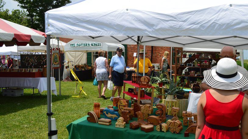 Visitors browse the vendors tents at the Hueston Woods Arts & Crafts Fair in 2016. CONTRIBUTED/BOB RATTERMAN