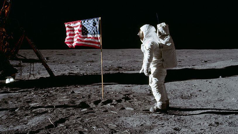 Astronaut Buzz Aldrin and the American flag on the moon during the Apollo 11 mission July 20, 1969. NASA hopes too return humans to the lunar surface by 2024, including the first-ever woman.