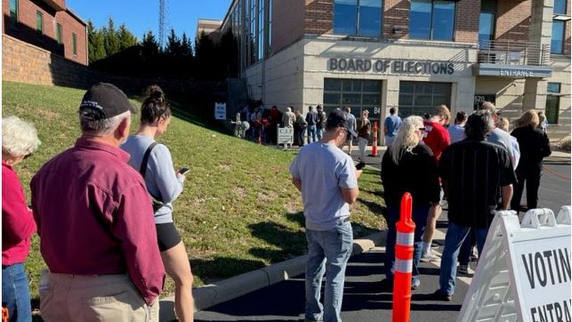 Warren County residents enjoyed a beautiful and sunny fall day as they stood in line waiting to cast an early vote at the Warren County Board of Elections. ED RICHTER/STAFF