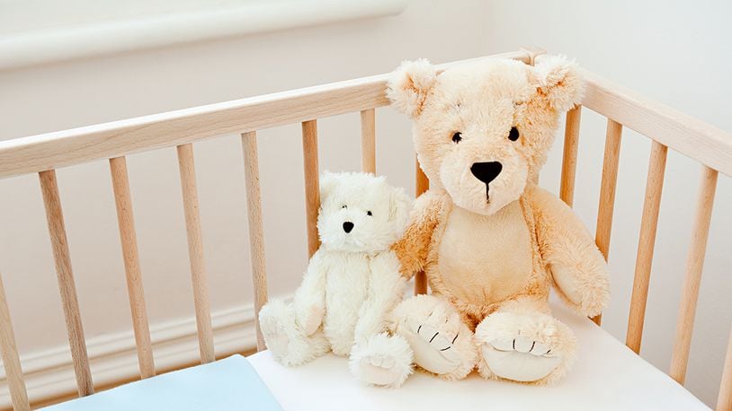 Teddy bears on crib