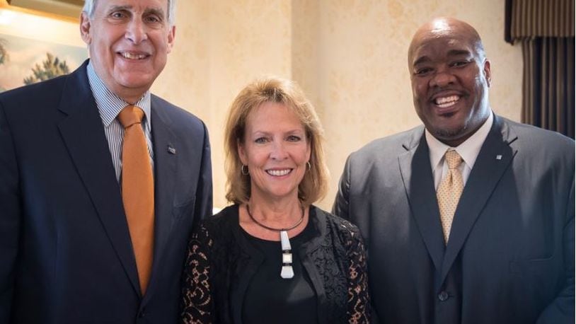 Former United Way CEO Rob Reifsnyder (from left); board chair Julia Poston; and Michael Johnson.