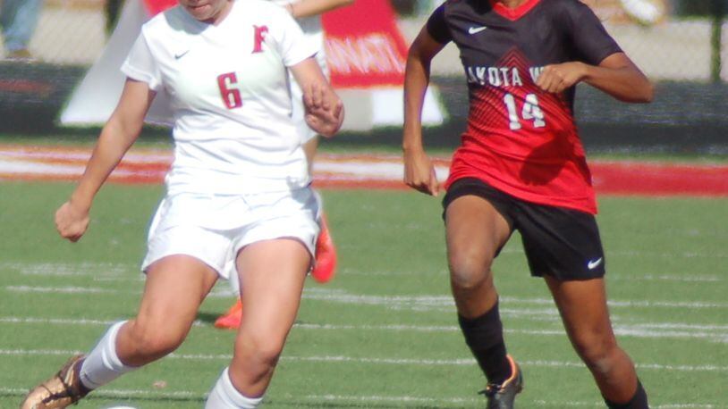 Fairfield’s Lily Welch (6) plays the ball up the field as Lakota West’s Divya Patel applies pressure Saturday afternoon during a Division I sectional soccer semifinal at Fairfield. CONTRIBUTED PHOTO BY JOHN CUMMINGS