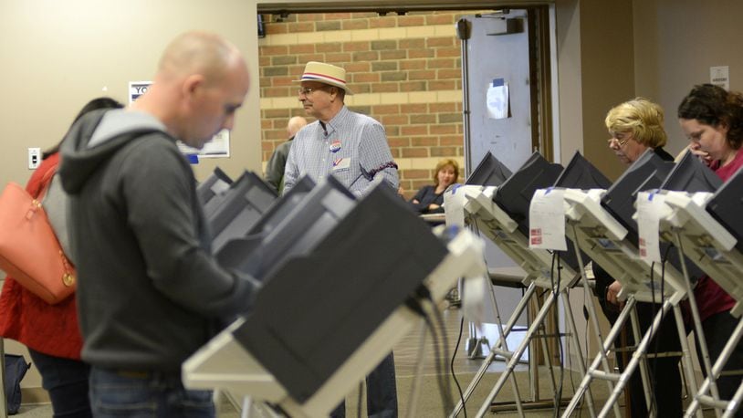 A poll worker looks over the voting area inside Fairfield High School on Holden Boulevard where Fairfield residents cast ballots on Election Day, Nov. 8, 2016. Though president is driving most voters on Election Day to the polls, Fairfield voters will decide on a 2.5-mill fire/EMS levy. MICHAEL D. PITMAN/STAFF