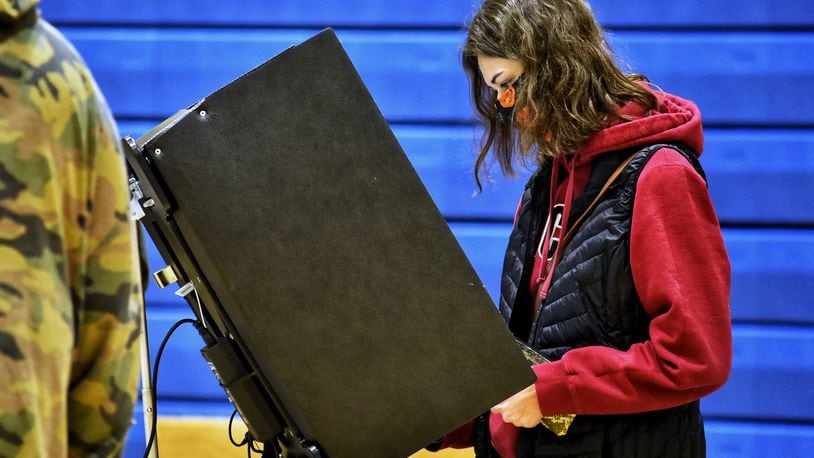 Alexys Napier, 18, votes for the first time on election day Tuesday, Nov. 3, 2020 at Wilson Middle School in Hamilton. NICK GRAHAM / STAFF