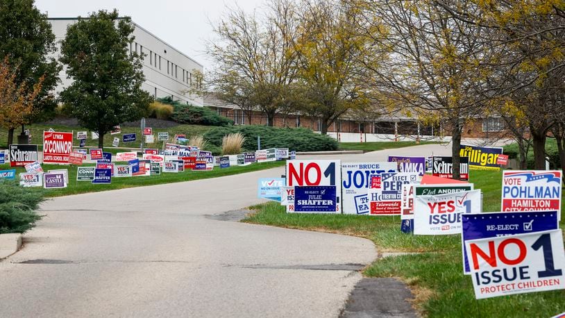 Political signs line the entrance at Butler County Board of Elections office Thursday, Oct. 19, 2023 in Hamilton. NICK GRAHAM/STAFF