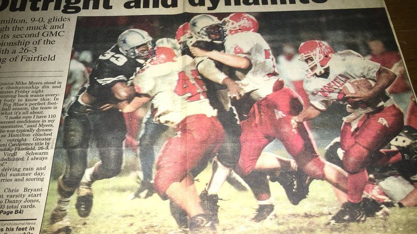 Fairfield’s Gerome Jones chops his feet in the muck of Virgil Schwarm Stadium while teammate Matt Traxler (46) leads the way against Hamilton’s Gary Richardson during a Week 9 game in 1997. GREG LYNCH/STAFF