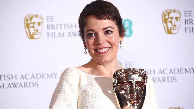 Actress Olivia Colman poses backstage with her Best Actress award for her role in the film 'The Favourite poses for photographers backstage at the BAFTA awards in London, Sunday, Feb. 10, 2019.