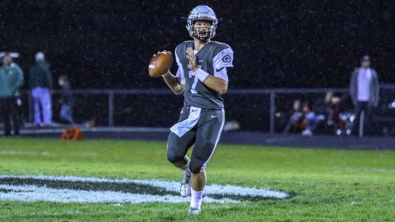 Greenon High School quarterback Cade Rice rolls out to throw a pass during their game against Madison Plains on Friday night at Greenon Stadium. The Knights won 24-16. CONTRIBUTED BY MICHAEL COOPER