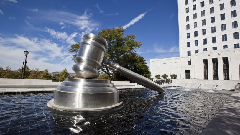 The Gavel Sculpture in downtown Columbus sits in the reflecting pool alongside the Ohio Supreme Court building.