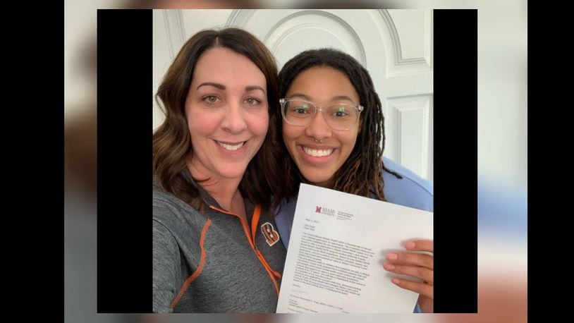 Miami social work major Alia Agee poses with an acceptance letter to the internship program with her stepmother Cindy. CONTRIBUTED/OXFORD OBSERVER