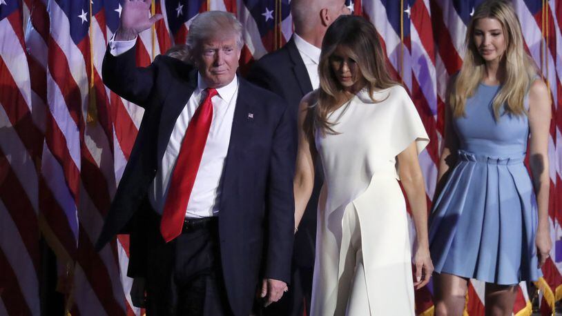 President-elect Donald Trump waves as he walks with his wife, Melania Trump, followed by his daughter, Ivanka Trump, after giving his acceptance speech during his election night rally on Nov. 9 in New York.