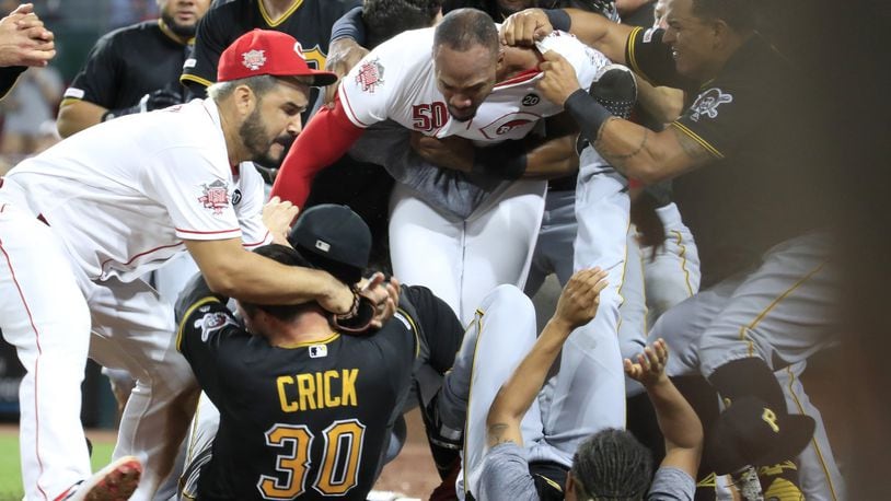 Amir Garrett (middle white shirt without hat) of the Cincinnati Reds engages members of the Pittsburgh Pirates during a bench clearing altercation in the 9th inning of the game at Great American Ball Park on Tuesday, July 30, 2019 in Cincinnati. (Photo by Andy Lyons/Getty Images)